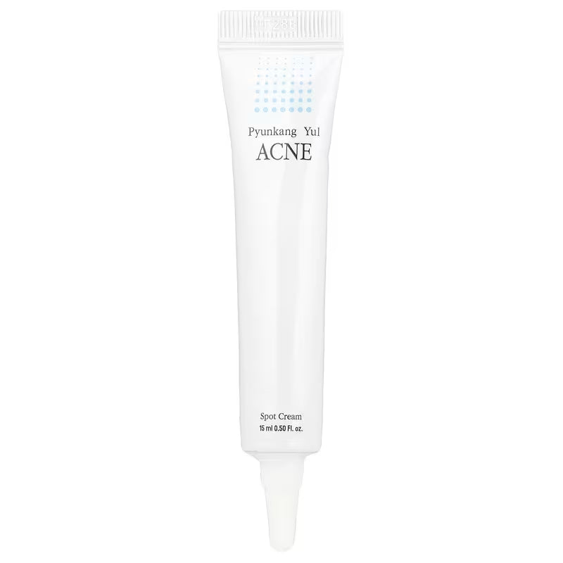 Um tubo branco de Pyunkang Yul Acne Spot Cream, tamanho 15 ml, com um design minimalista que apresenta pontos azuis perto do topo, transmitindo simplicidade e eficácia. Cosmetica Coreana.