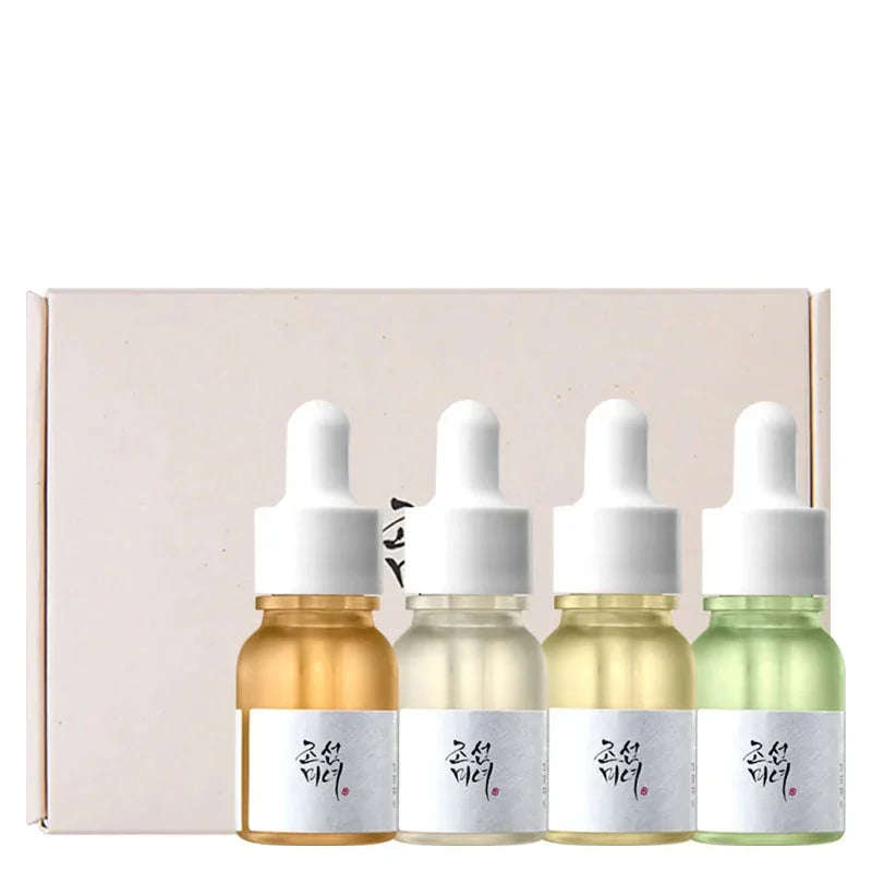 Kit de séruns coreanos com quatro frascos conta-gotas coloridos, ideal para cuidados faciais K-Beauty.