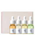 Kit de séruns coreanos com quatro frascos conta-gotas coloridos, ideal para cuidados faciais K-Beauty.