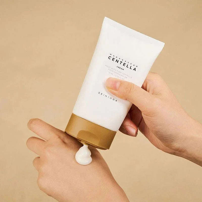 Creme facial SKIN1004 Centella Madagascar em embalagem branca e tampa dourada, 75ml, cosmético coreano.